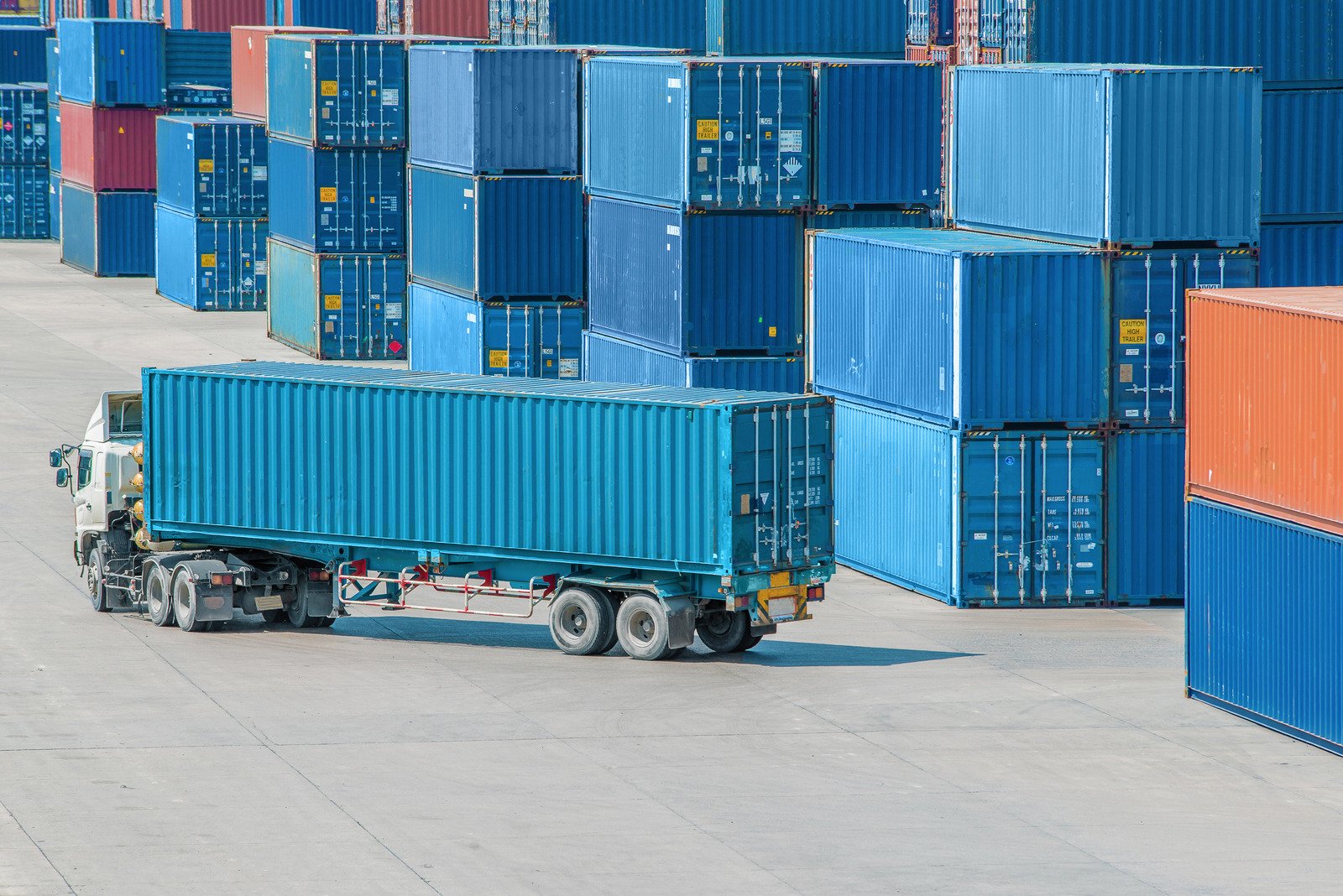Container truck moving through a yard